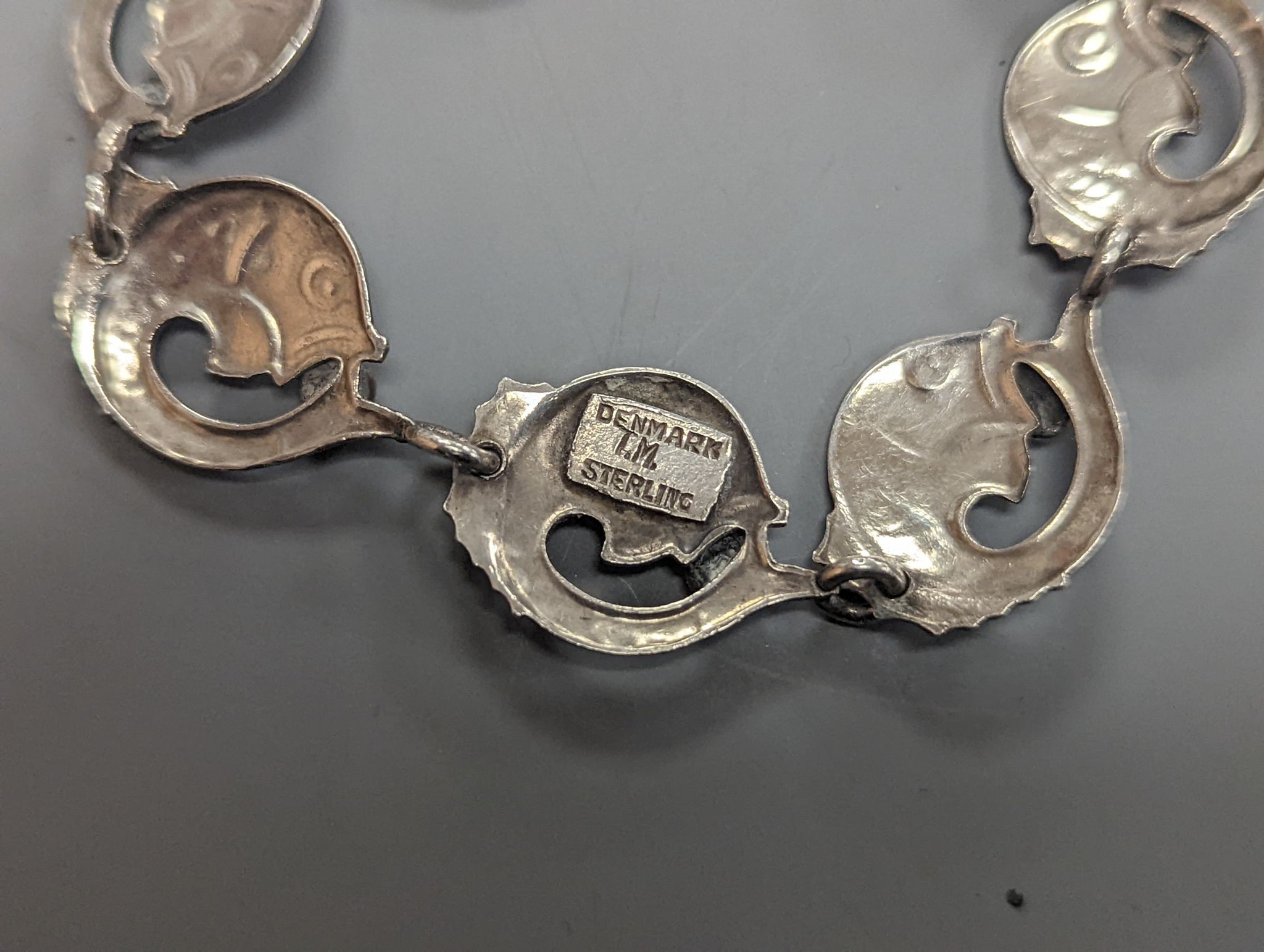 A Danecraft sterling flower head link necklace, 42cm and a Danish sterling fish link bracelet.